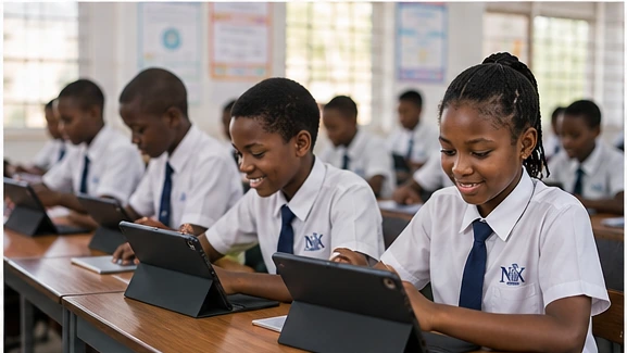 African secondary student working at a computer at school